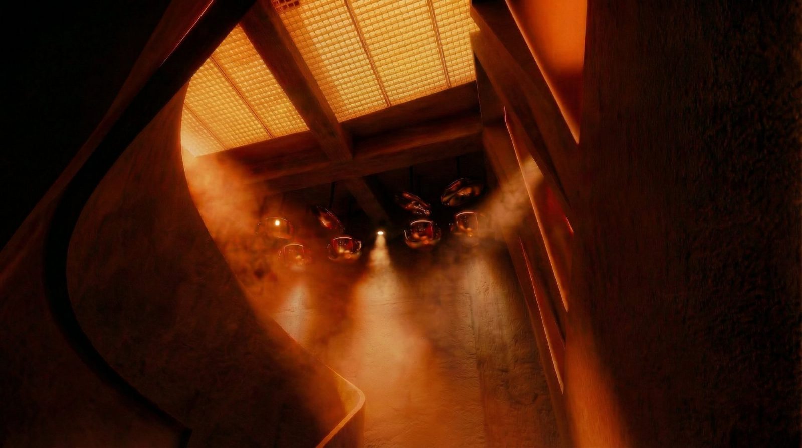 Mombassa, Tarifa: escalera curva de hormigón con lámparas esféricas de cobre — Studio Eleven