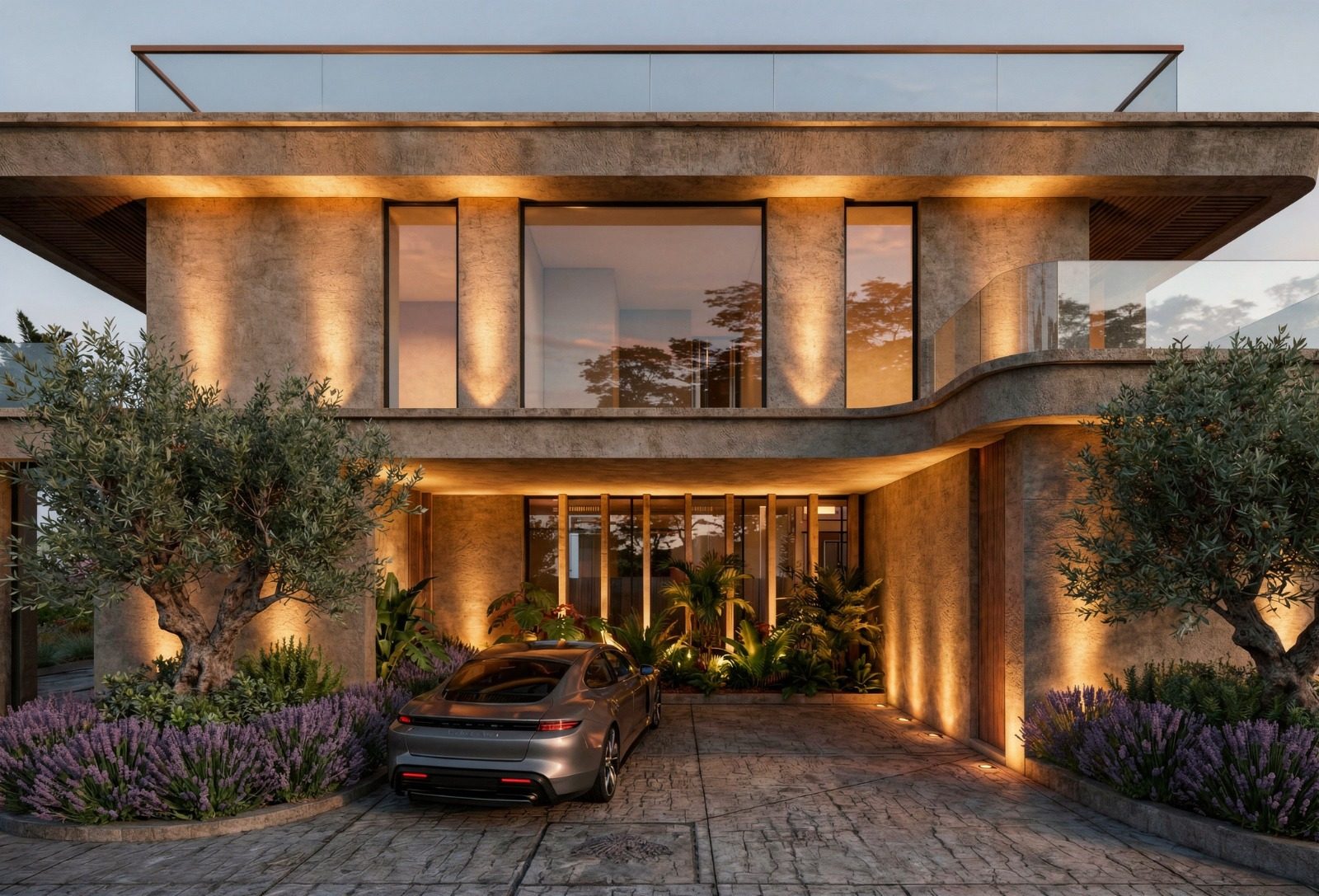 Villa Río Verde, Marbella: fachada principal con iluminación nocturna, olivos y acceso de vehículos — Studio Eleven