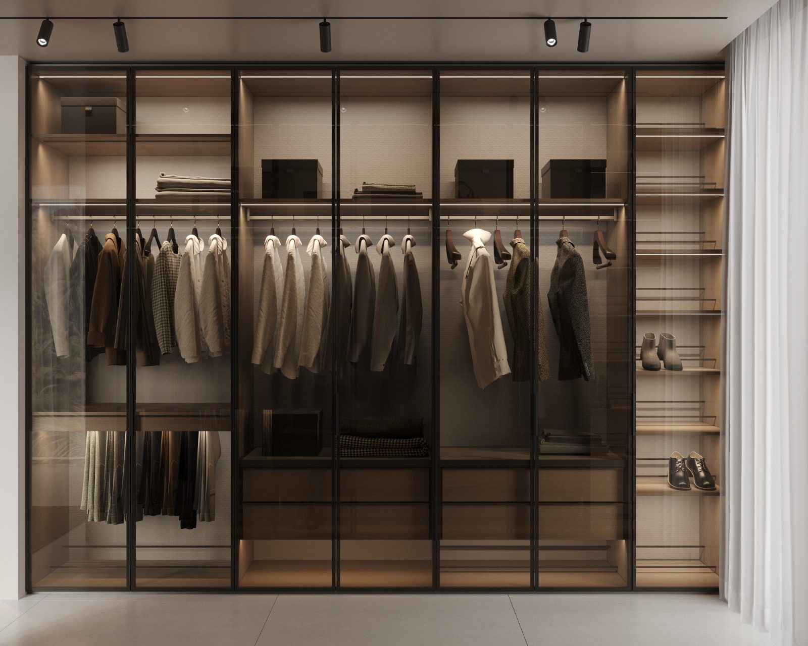 Villa VOG, Marbella: vestidor a medida con puertas de vidrio e iluminación integrada — Studio Eleven